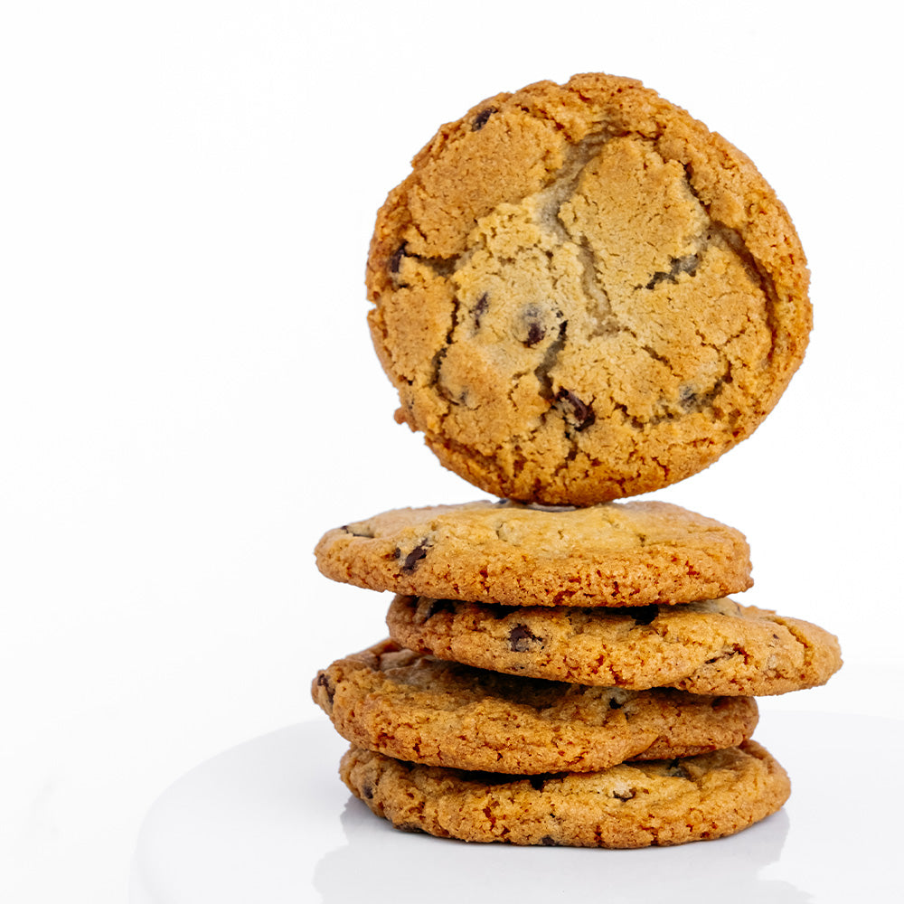 Ginger Elizabeth Chocolates stack of chocolate chip cookies on white background