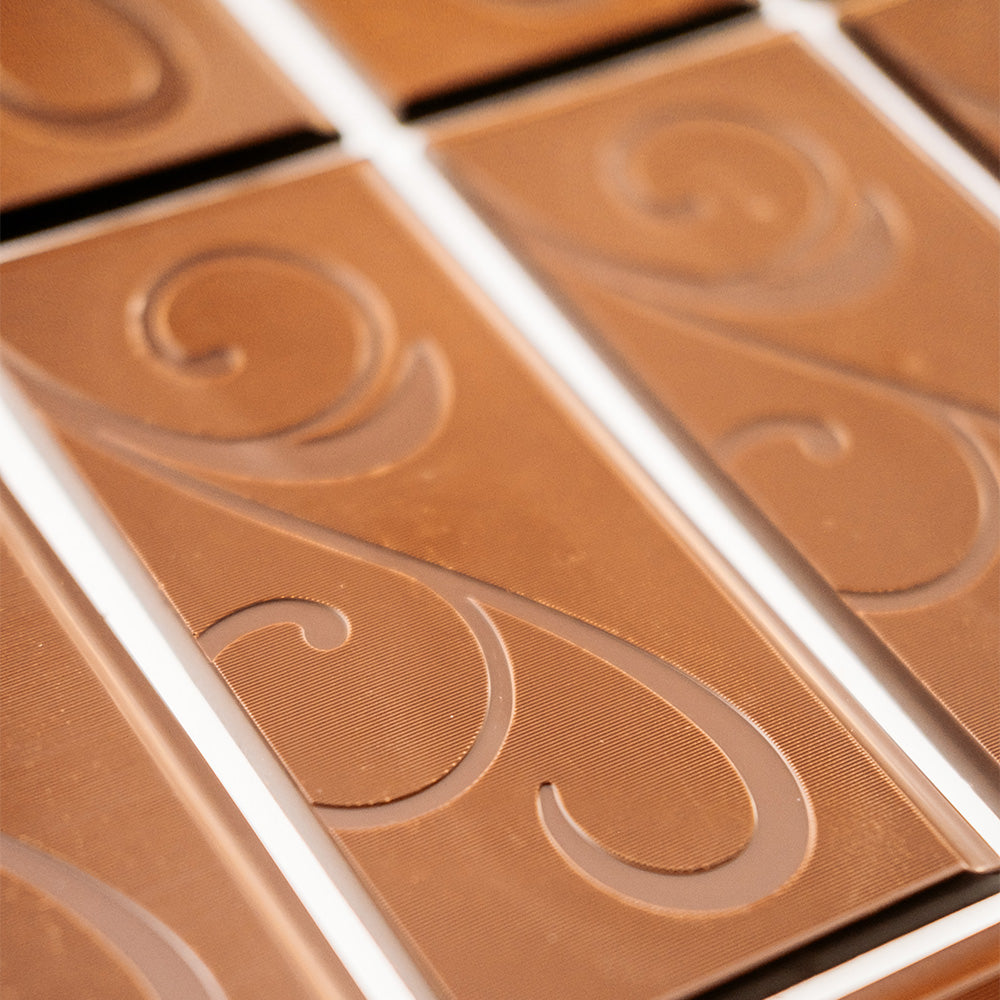 Close up of chocolate bar with scroll detailing