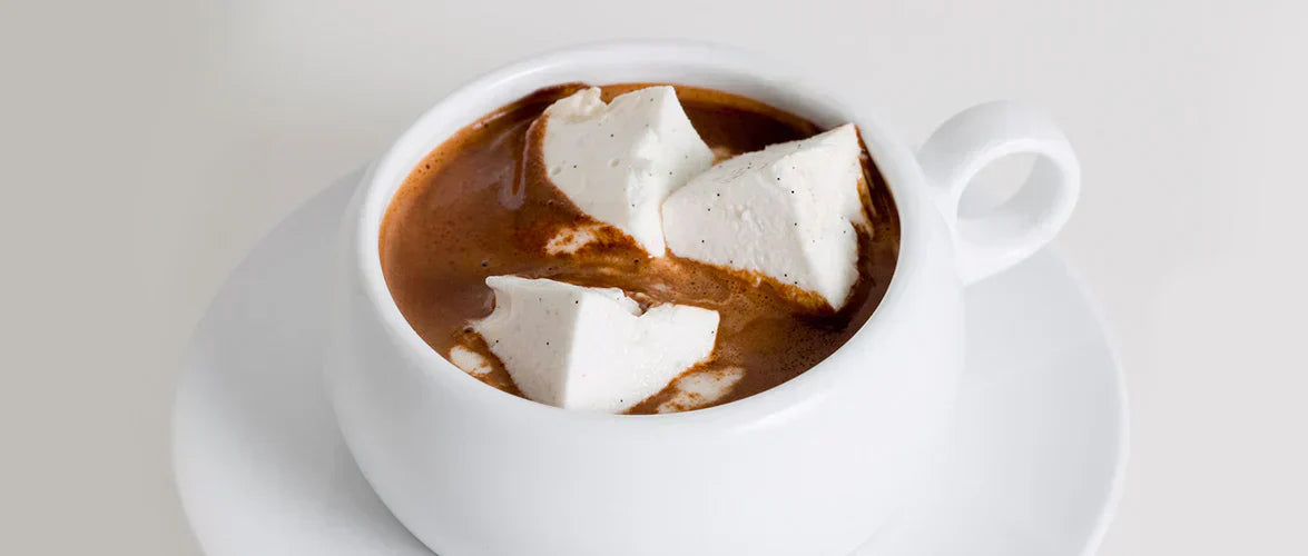 Ginger Elizabeth Chocolates European Sipping Chocolate with Marshmallows in white mug with saucer on white background.