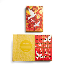 Ginger Elizabeth Chocolates 2024 Advent calendar closed box above open box red and gold holiday design with white doves