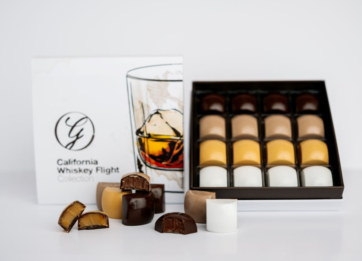 California whiskey flight collection boxed and loose chocolates on white background