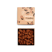 Box of chocolate candied almonds with a matching packaging box on a white background