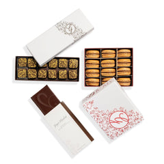 Ginger Elizabeth Chocolates 12 piece box palet d'or chocolates, 12 piece box chocolate ganache macarons and chocolate bar on white background 