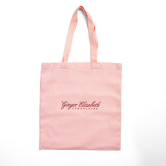 Ginger Elizabeth Chocolates signature on pink tote on white background