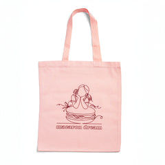 Ginger Elizabeth Chocolates Macaron Dream Pink Tote bag with line drawing of girl leaning on macaron cookie over the words macaron dream on white background