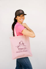 Ginger Elizabeth carrying the pink macaron dreams tote displaying the macaron girl drawing