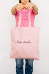 Ginger Elizabeth holding the macaron dreams tote with signature logo showing