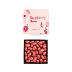 Ginger Elizabeth Chocolates Raspberry Rose Almonds in box with lid above on white background. 