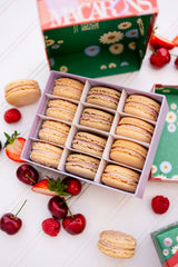 ginger elizabeth chocolates close up of open summer macaron box with macaron cookies and fresh fruit on white beadboard