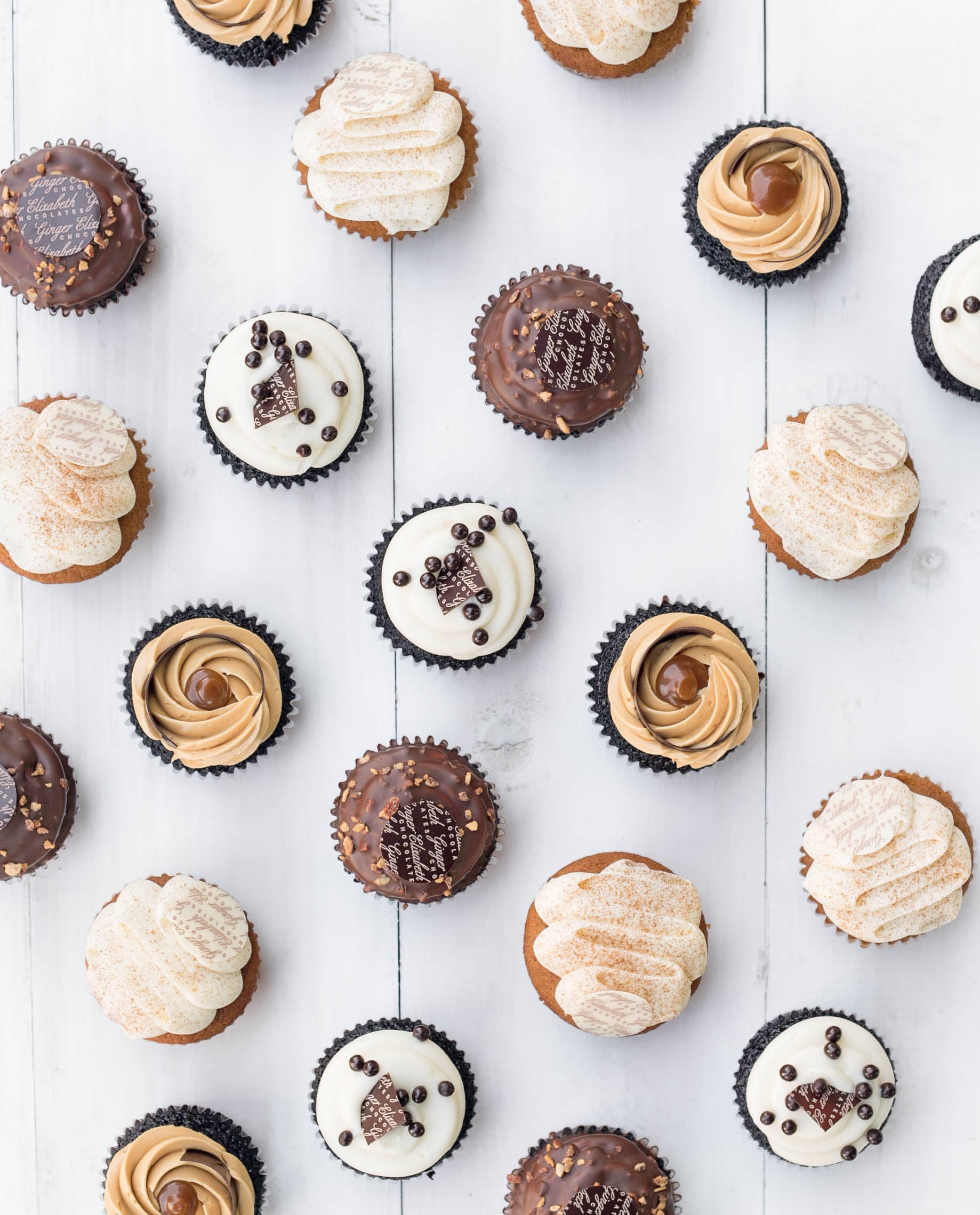 Ginger Elizabeth Chocolates assortment of cupcakes on white background