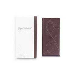 Ginger Elizabeth Chocolates 69% Madagascar Couverture Chocolate Bar and packaging on white background