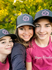 Ginger Elizabeth with sons wearing Grey trucker hat with G logo