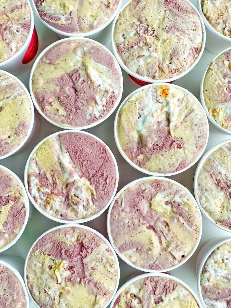 Ginger Elizabeth Chocolates Cherry Pistachio Baked Alaska Ice Cream Pints shown from above.
