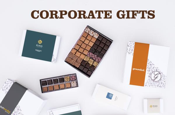 Corporate Gifts messaging across topwith boxed chocolates with customized sleeves